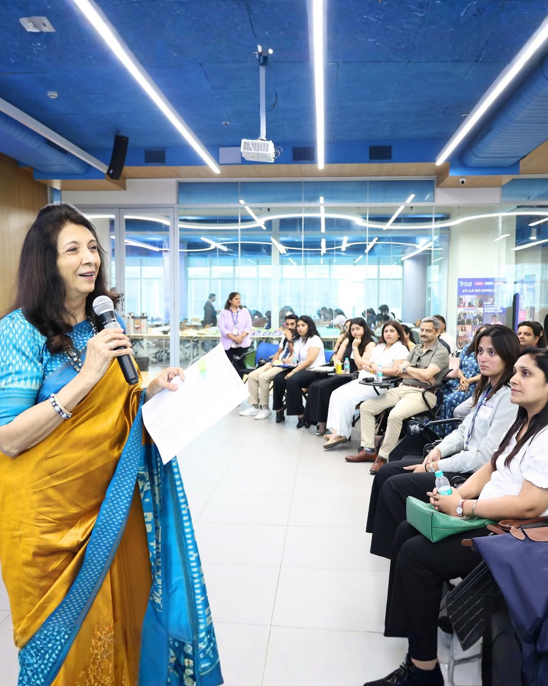 Photo by ATLAS SkillTech University on April 19, 2026. May be an image of one or more people, people smiling, dais, office and text.